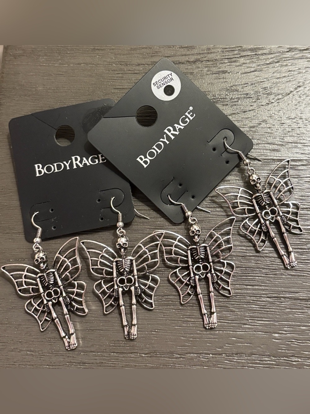 NWT Set of 2 Body Rage Winged Skeleton Earrings